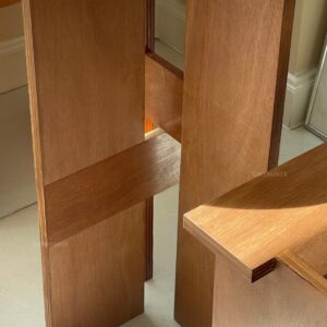 close-up of natural plywood dining set showing table edge and chair detail