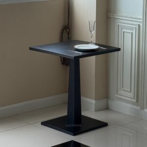 black parawood table styled with props for modern café or dining setting