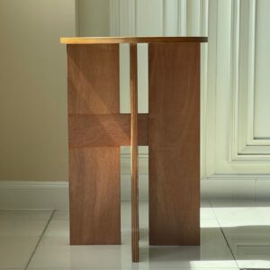 front view of round plywood table with natural wood finish
