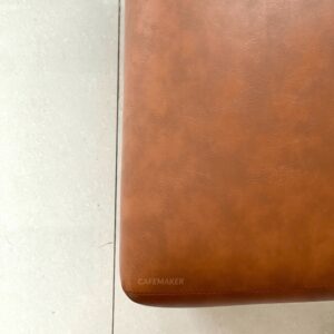 close-up of orange cushion chair showing fabric texture and seat detail